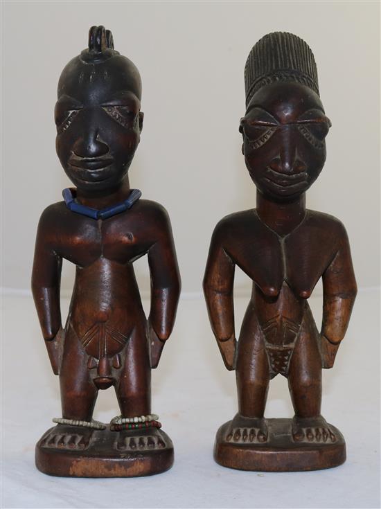 Two Yoruba wood figures of a man and a woman, late 19th/early 20th century, 9in.
